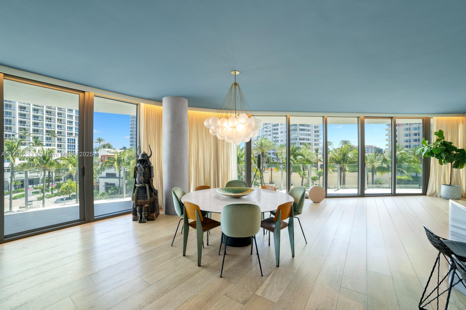1 Collins Avenue, Unit 401 Miami Beach, FL 33139 - Photo 11 of 25 a dining room with furniture and wooden floor