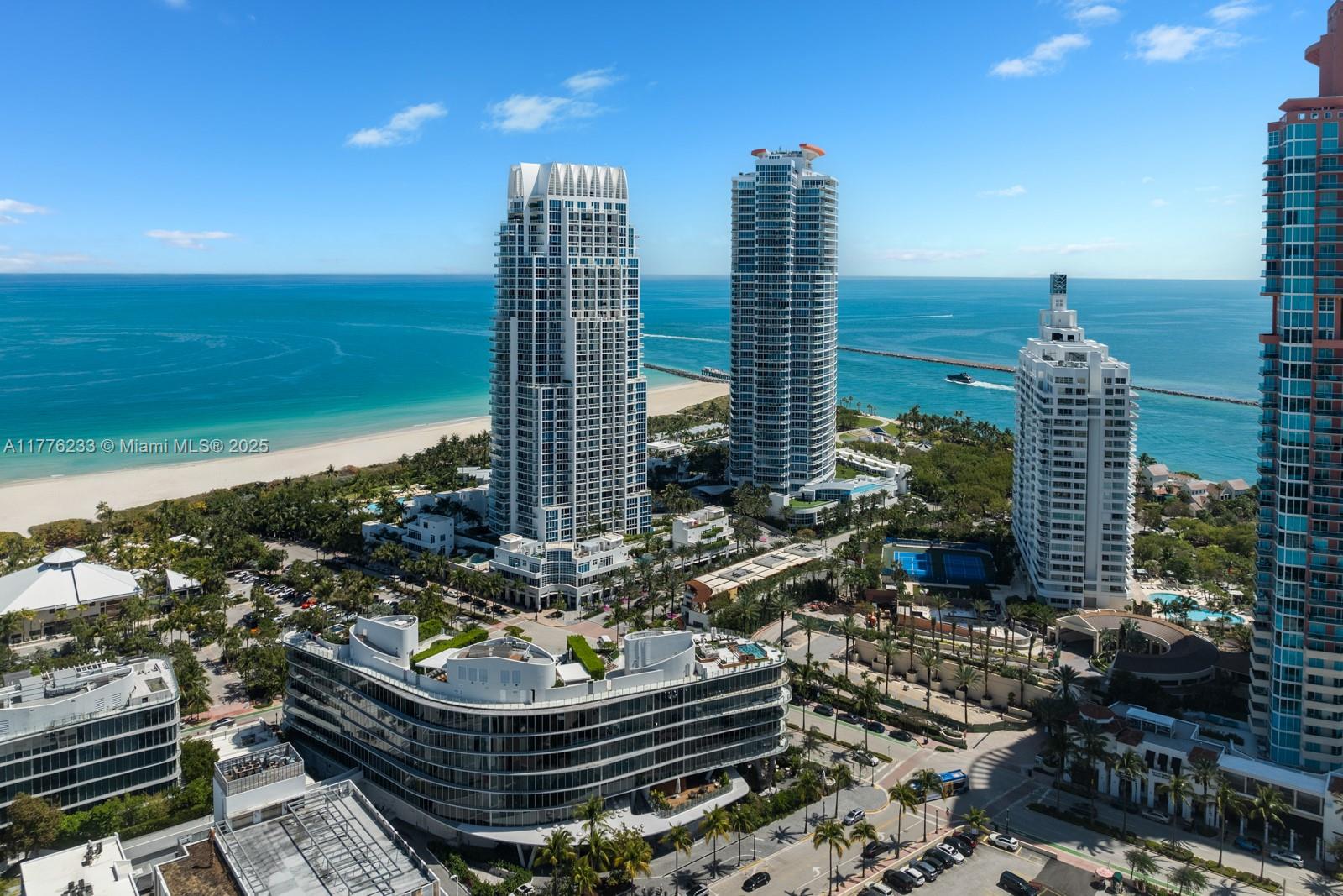 1 Collins Avenue, Unit 401 Miami Beach, FL 33139 - Photo 2 of 25 a front view of a city with ocean view