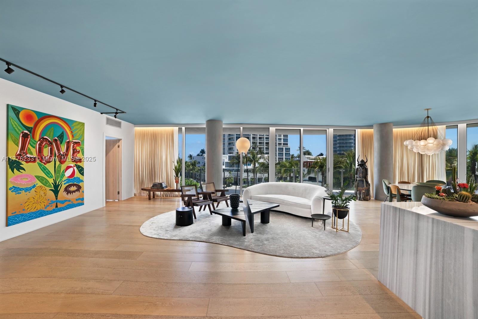 1 Collins Avenue, Unit 401 Miami Beach, FL 33139 - Photo 5 of 25 a living room with furniture and large windows