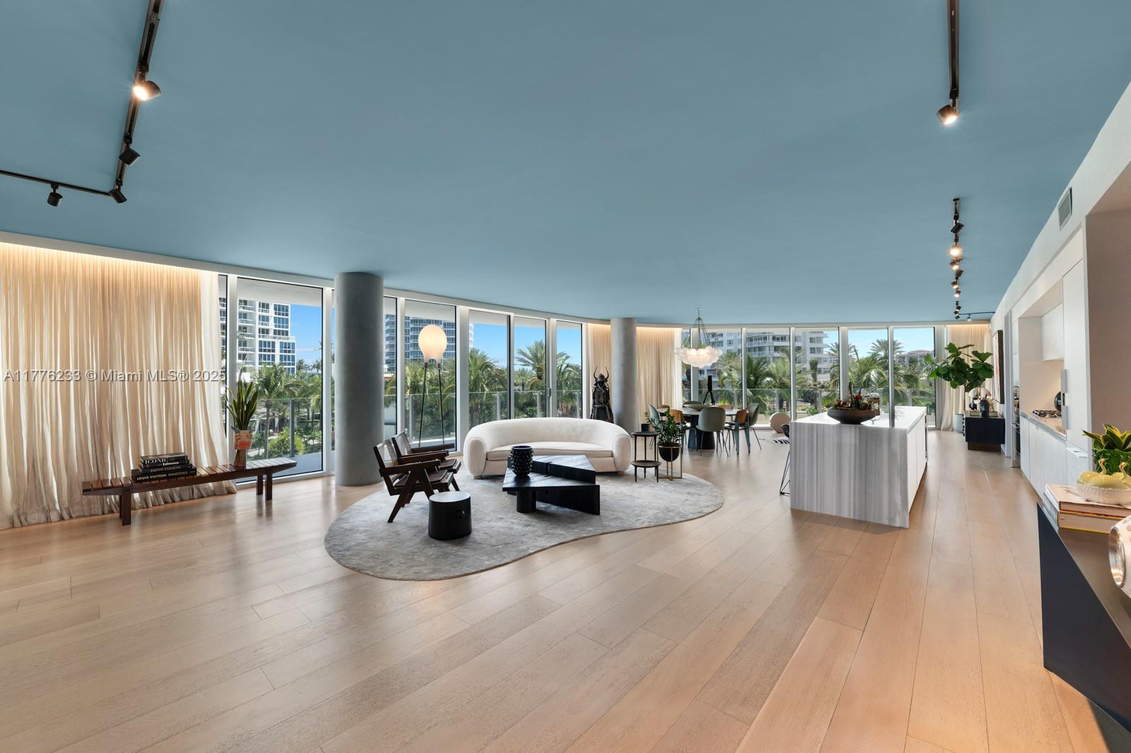 1 Collins Avenue, Unit 401 Miami Beach, FL 33139 - Photo 6 of 25 a lobby with furniture and floor to ceiling window