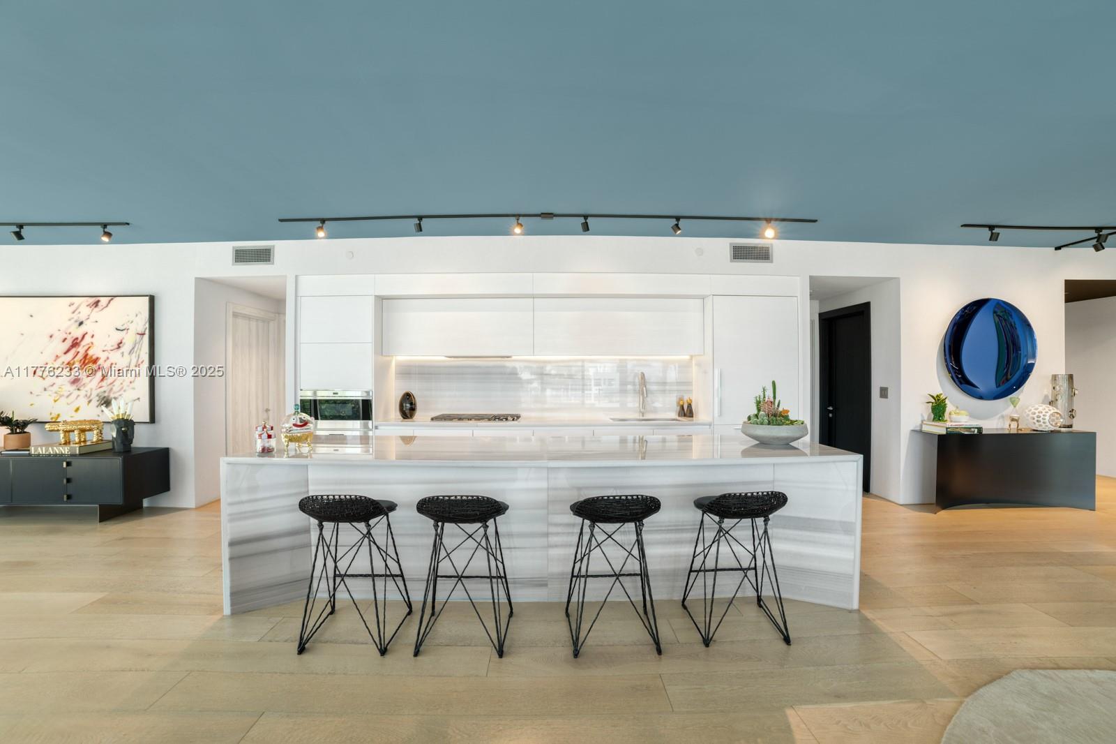 1 Collins Avenue, Unit 401 Miami Beach, FL 33139 - Photo 9 of 25 a living room with furniture a rug and a large window