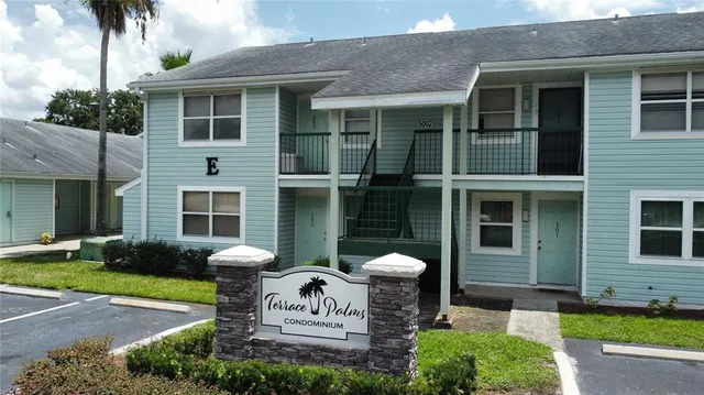 a front view of a house with garden and porch