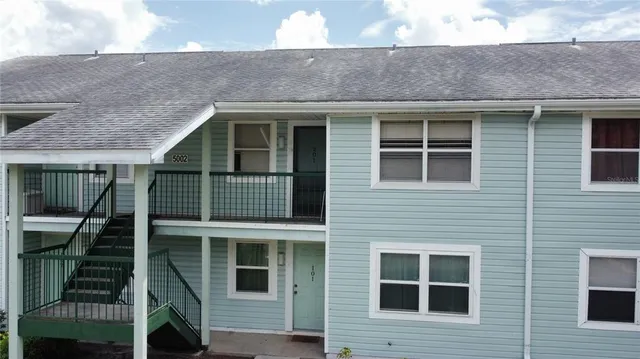 a front view of a house with a fence