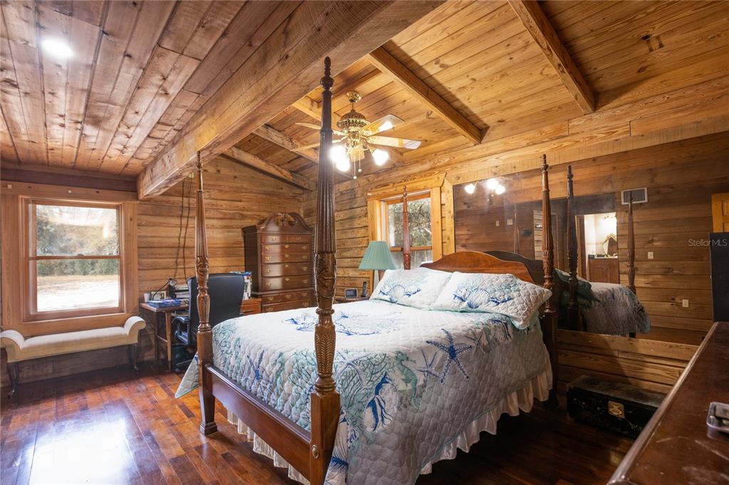 6892 Swain Road Sorrento, FL 32776 - Photo 14 of 57 a bed sitting in a bedroom next to a window