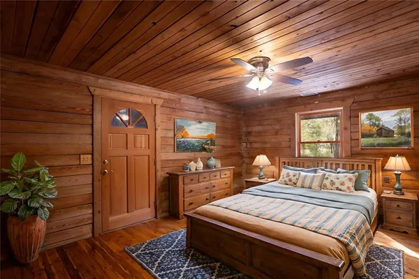a spacious bedroom with a bed and a table