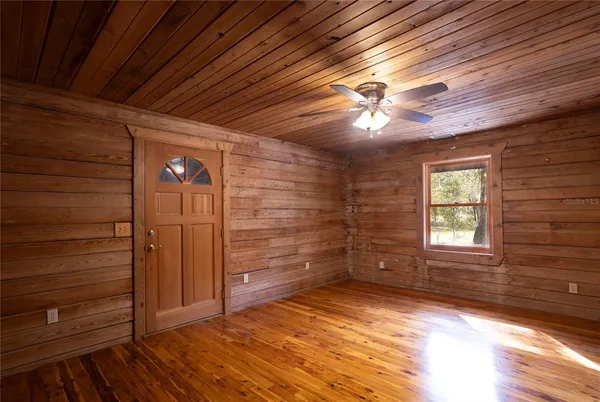 a view of an empty room with a fireplace