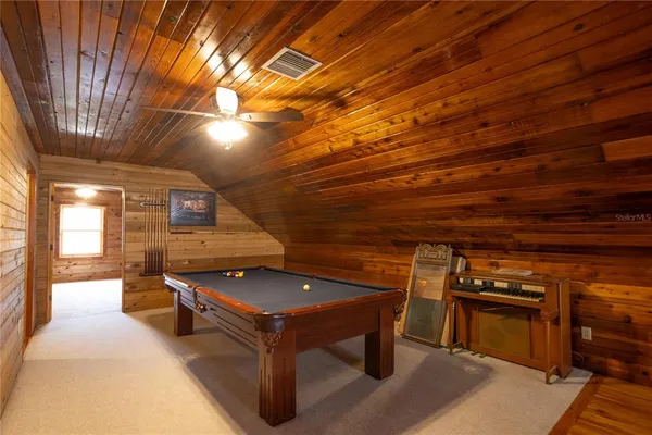a view of a livingroom with furniture and a window