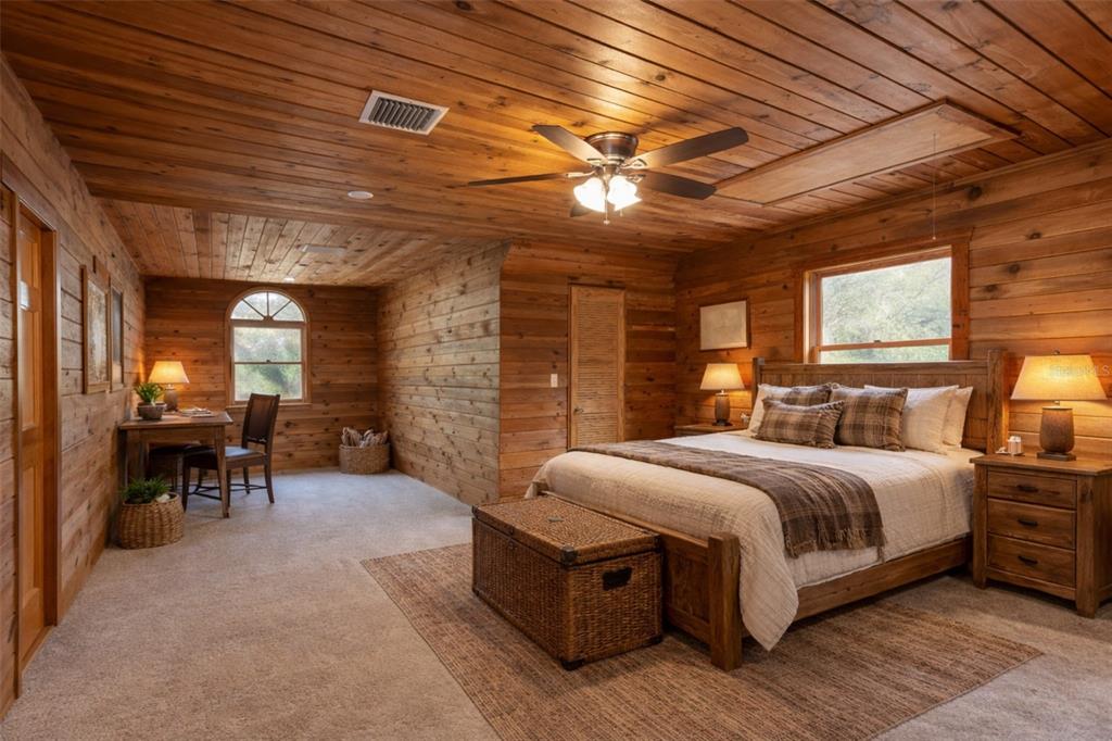 6892 Swain Road Sorrento, FL 32776 - Photo 24 of 57 a spacious bedroom with a bed and a table