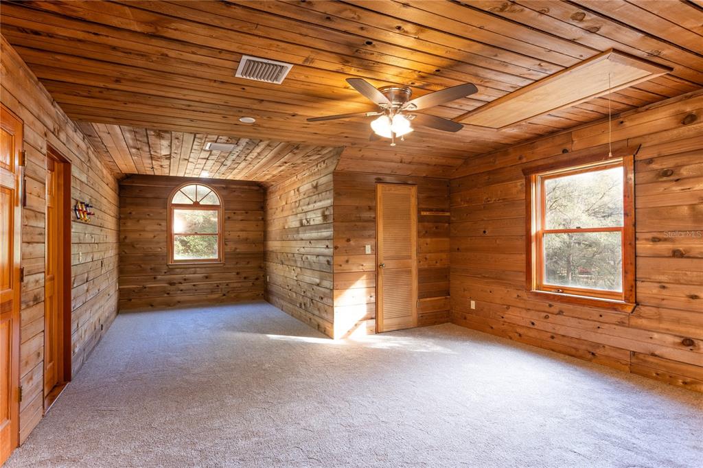 6892 Swain Road Sorrento, FL 32776 - Photo 25 of 57 a view of an empty room with a fireplace