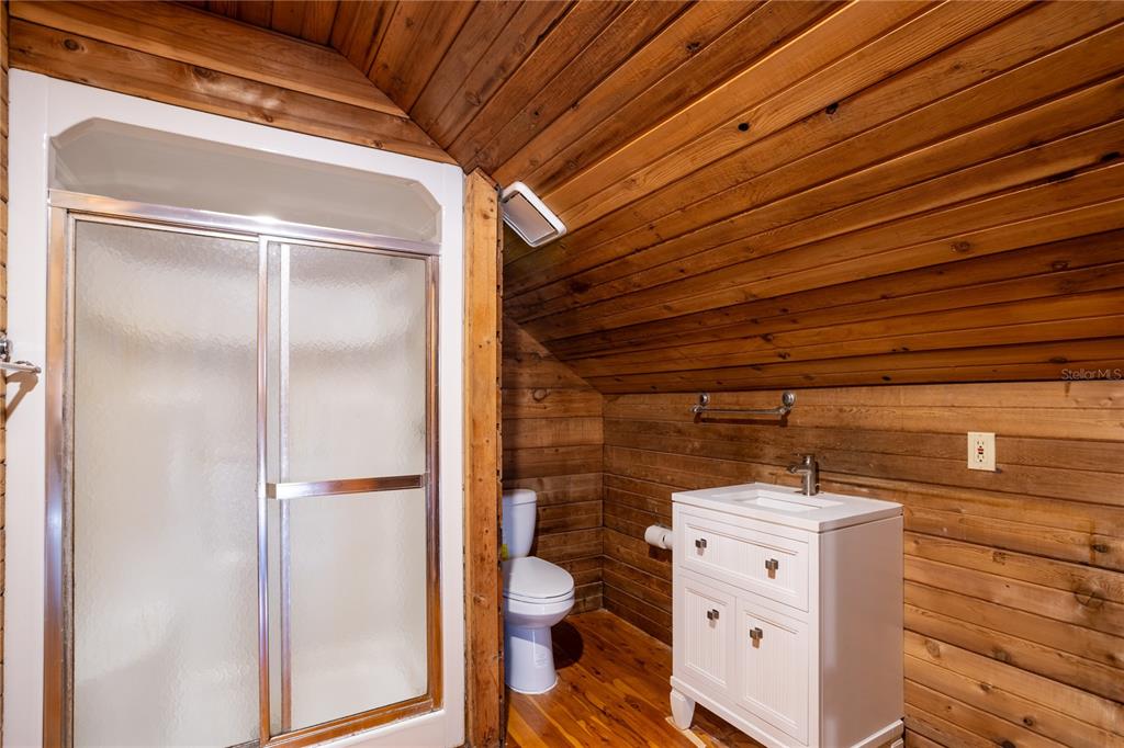 6892 Swain Road Sorrento, FL 32776 - Photo 26 of 57 a bathroom with a toilet and a shower