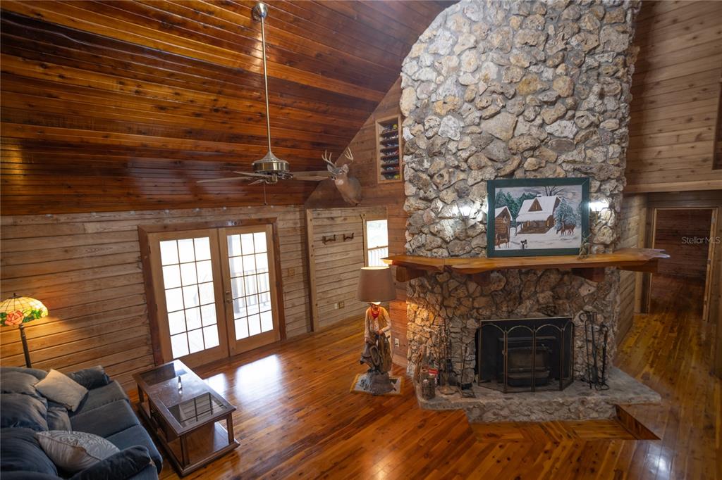 6892 Swain Road Sorrento, FL 32776 - Photo 30 of 57 a living room with furniture and a fireplace