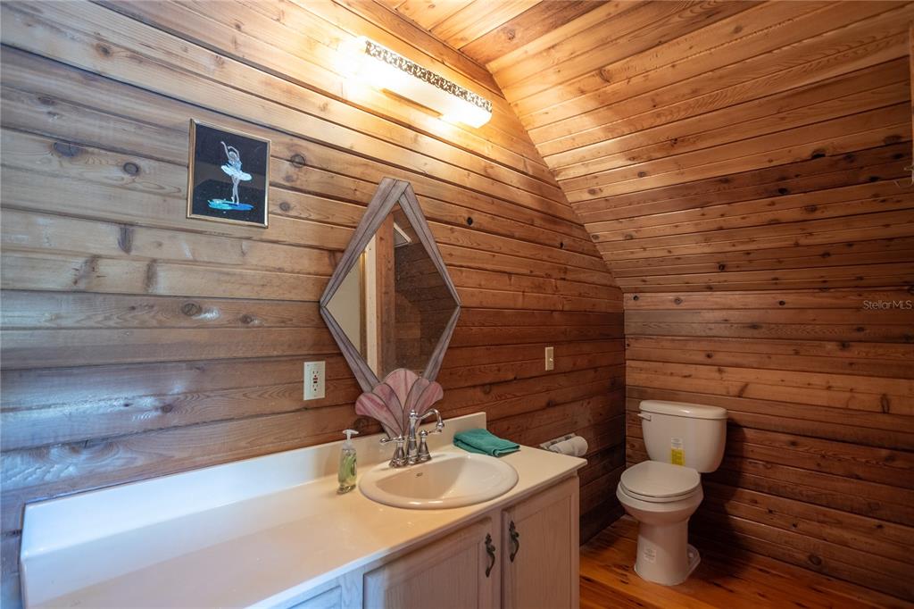 6892 Swain Road Sorrento, FL 32776 - Photo 33 of 57 a bathroom with a toilet and a sink