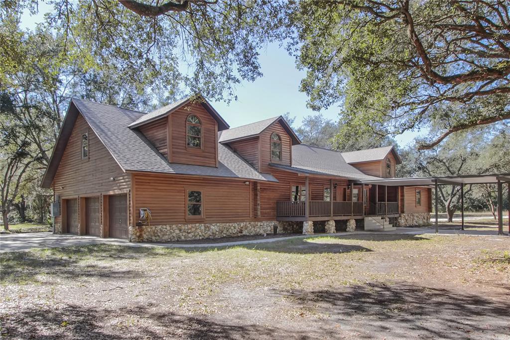 6892 Swain Road Sorrento, FL 32776 - Photo 39 of 57 front view of a house with a yard