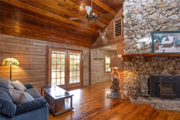 a dining room with furniture and wooden floor