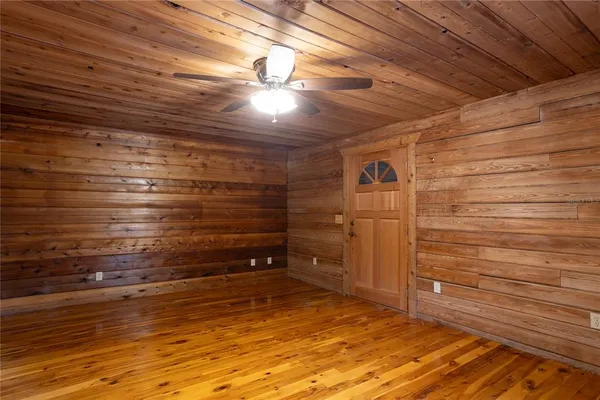 a view of an outdoor space with wooden floor