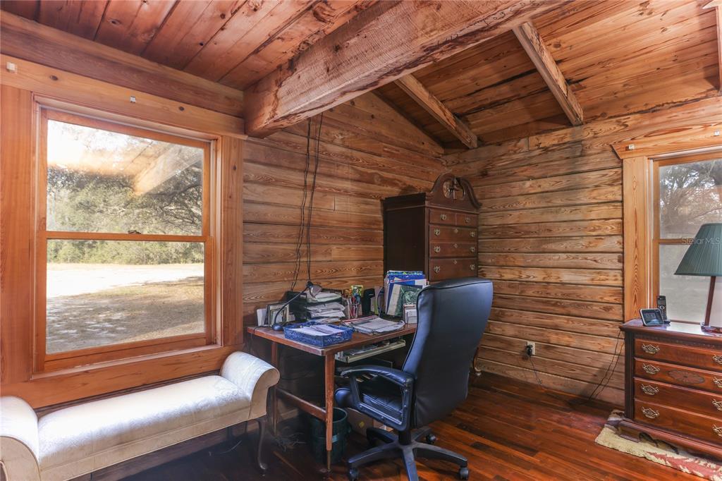 6892 Swain Road Sorrento, FL 32776 - Photo 49 of 57 a dining room with furniture and wooden floor