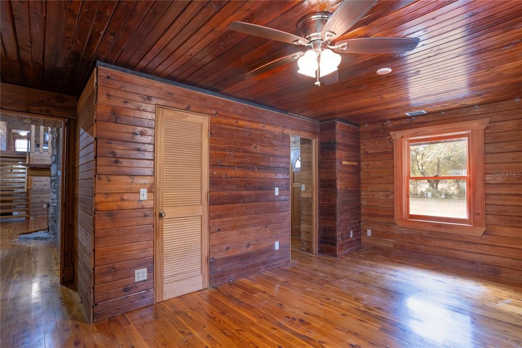 6892 Swain Road Sorrento, FL 32776 - Photo 50 of 57 a view of an empty room with wooden floor and a window