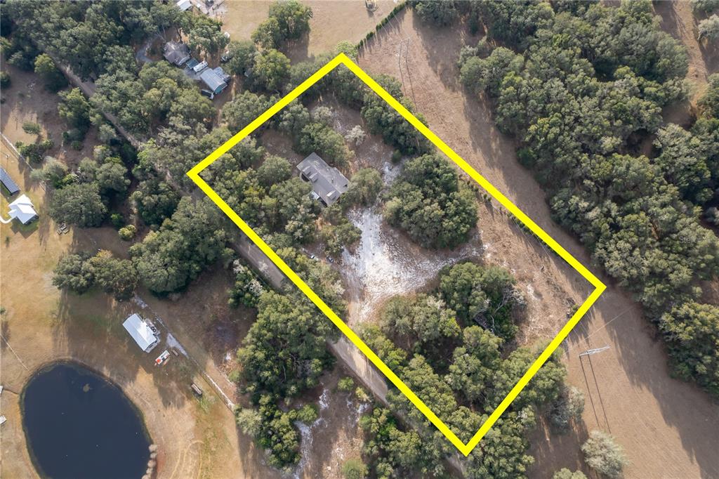 6892 Swain Road Sorrento, FL 32776 - Photo 57 of 57 a view of a small swimming pool with a outdoor seating