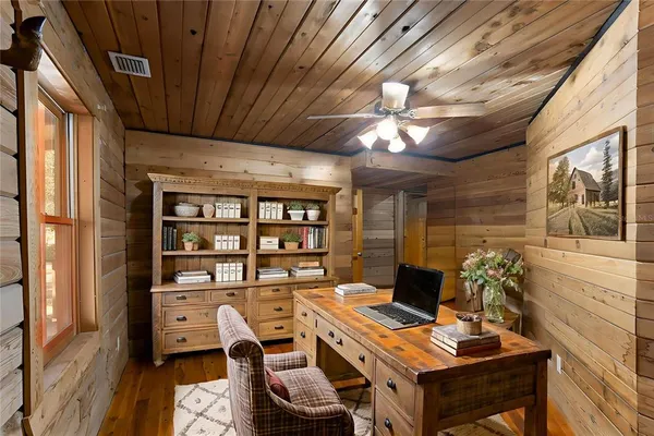 a view of a workspace with furniture