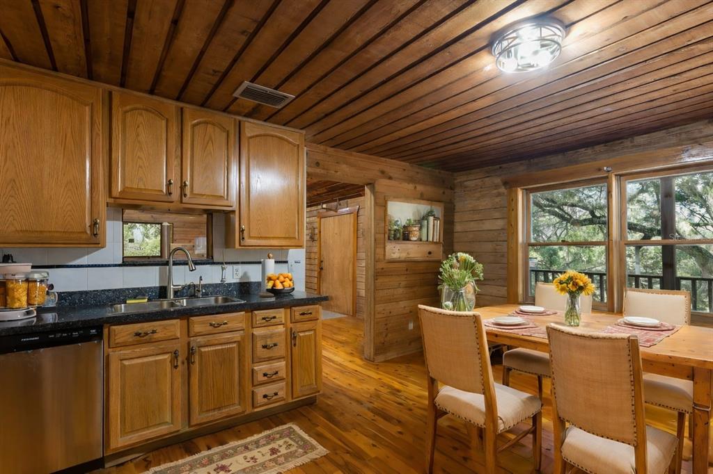 6892 Swain Road Sorrento, FL 32776 - Photo 10 of 57 a kitchen with granite countertop lots of counter top space and stainless steel appliances