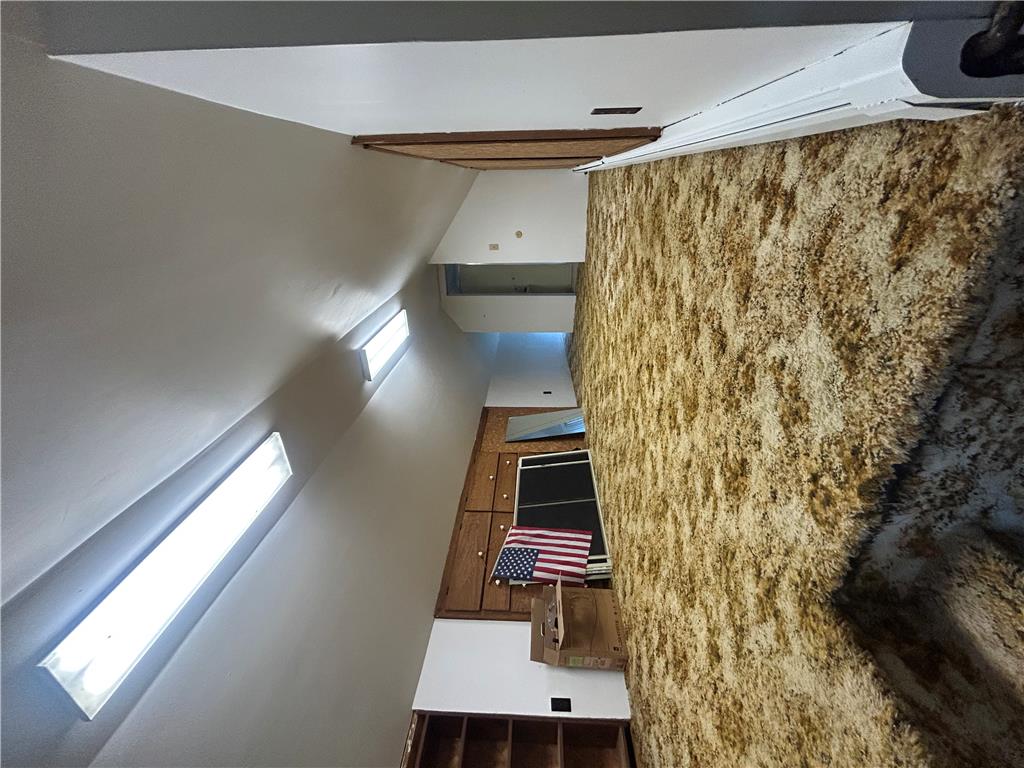 7 Allegheny Road Mount Bethel, PA 18343 - Photo 60 of 71 A long attic bonus room displays textured carpeting and sloped ceilings with integrated lighting fixtures.