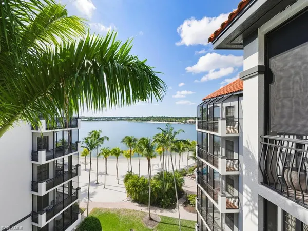 a view of swimming pool with outdoor seating and plants
