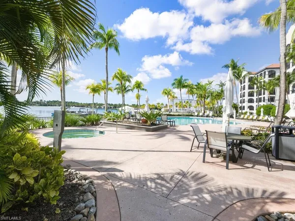 a view of three swimming pool and tall trees