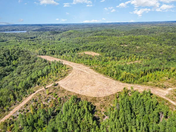 a view of a field with an ocean view