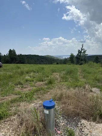 a view of a yard with an outdoor seating and mountain view