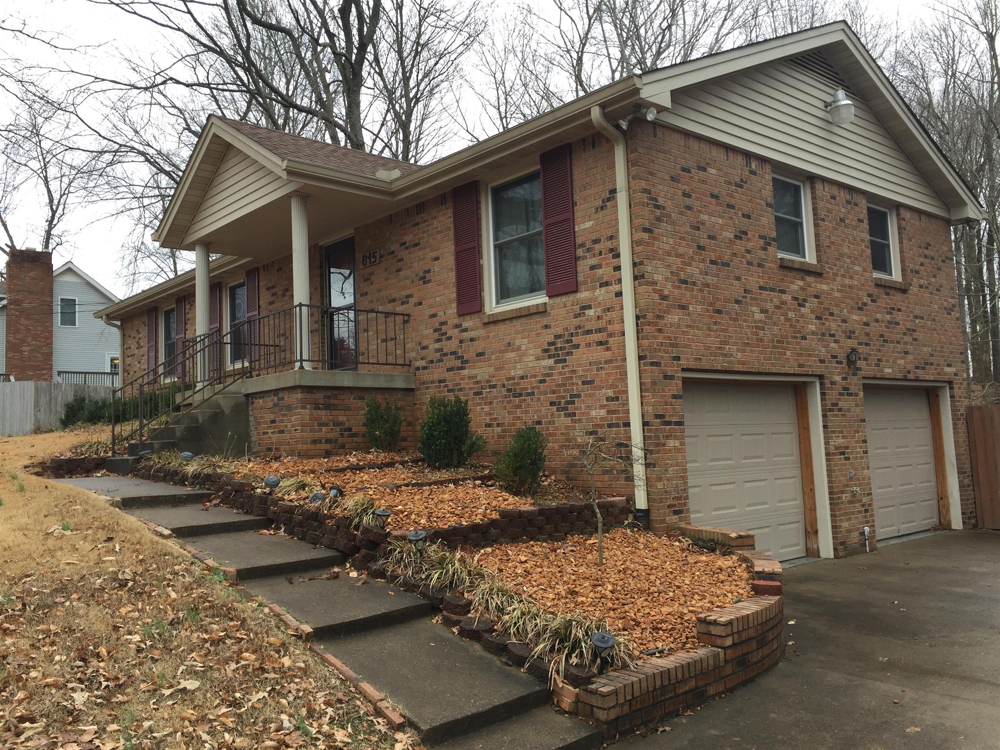 615 Bryan Road Clarksville, TN 37043 - Photo 1 of 22 a front view of a house with garden
