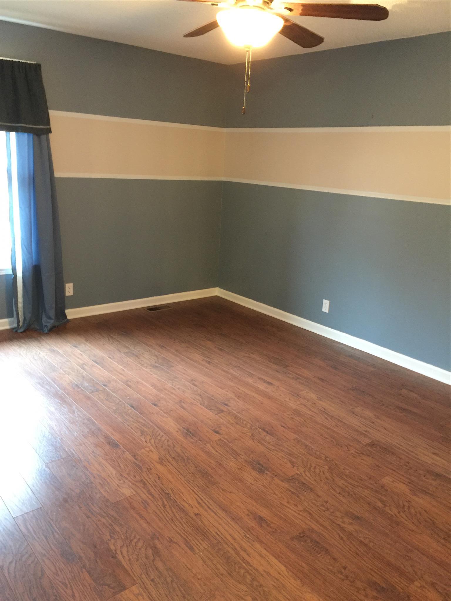 615 Bryan Road Clarksville, TN 37043 - Photo 11 of 22 a view of an empty room with wooden floor