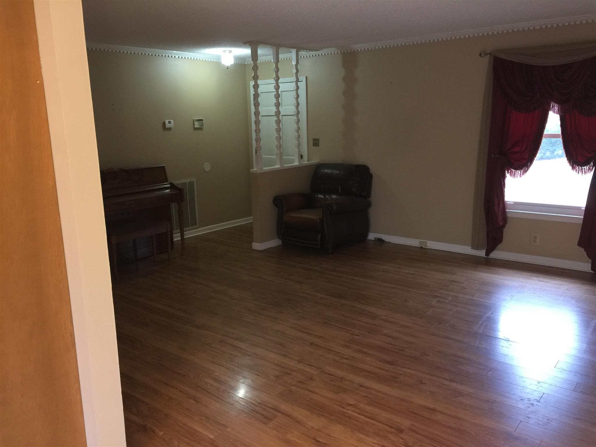 615 Bryan Road Clarksville, TN 37043 - Photo 6 of 22 a view of empty room with wooden floor and fan