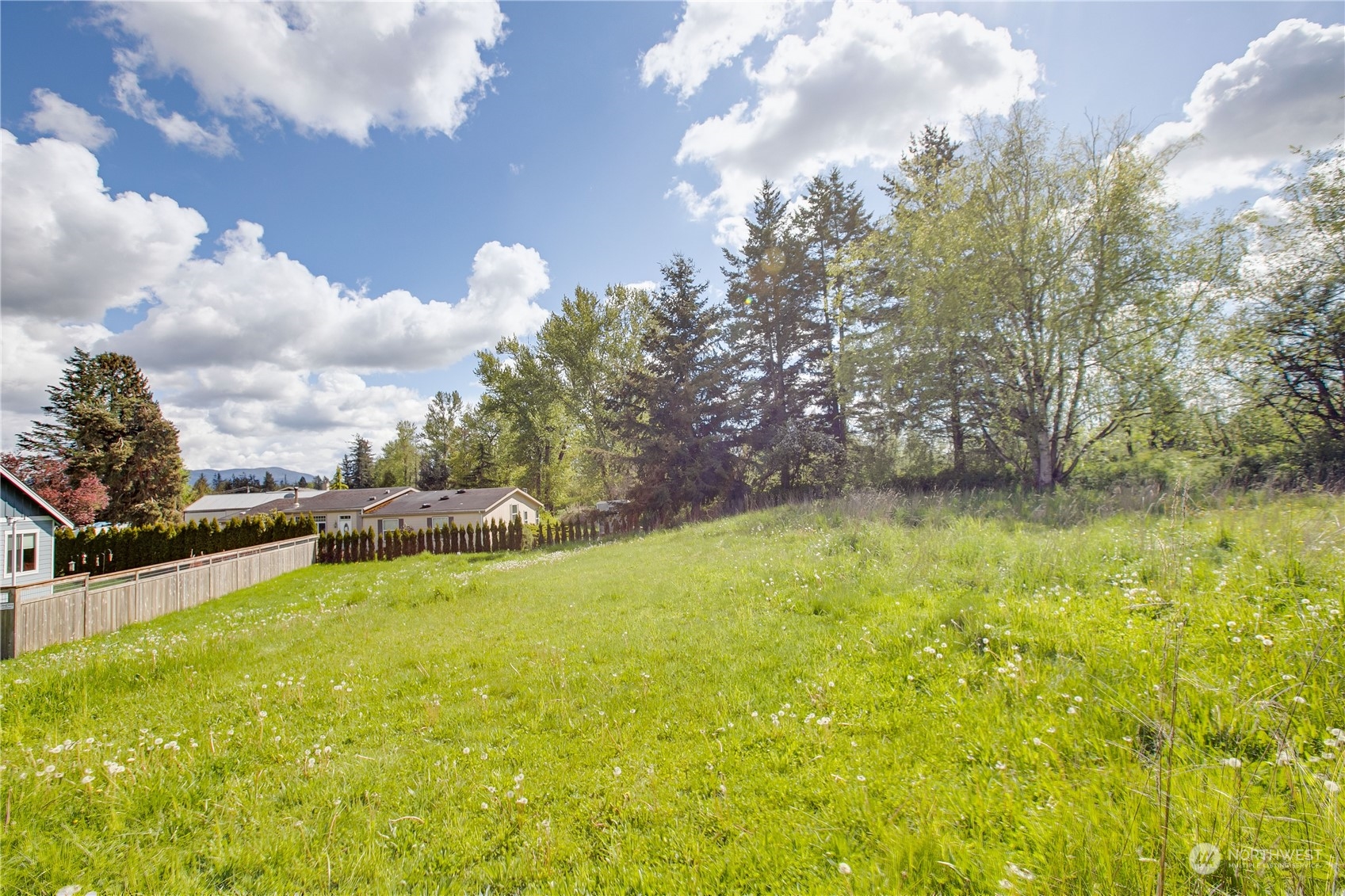 1305 Mission Road Everson, WA 98247 - Photo 5 of 19 a swimming pool with an outdoor space and seating area