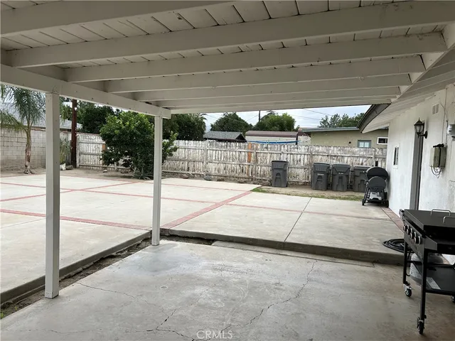 a view of a swimming pool with a patio