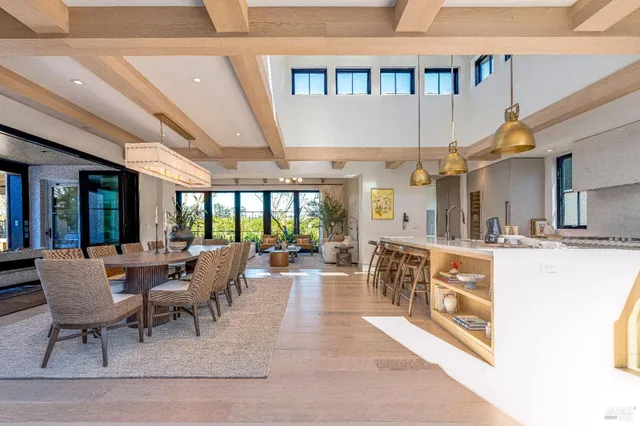 a living room with furniture and large window