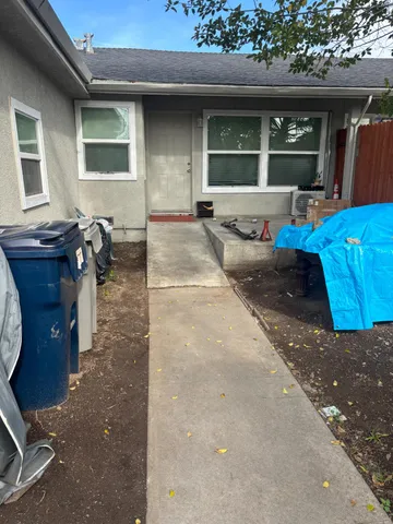 a view of a house with sitting area and furniture