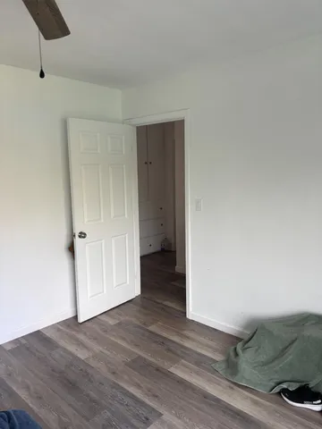 a view of a livingroom with wooden floor