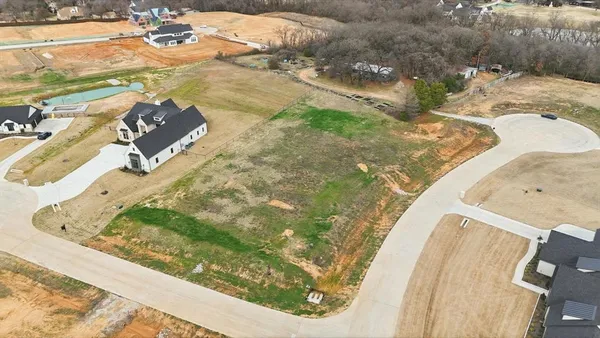 a view of a swimming pool with a yard