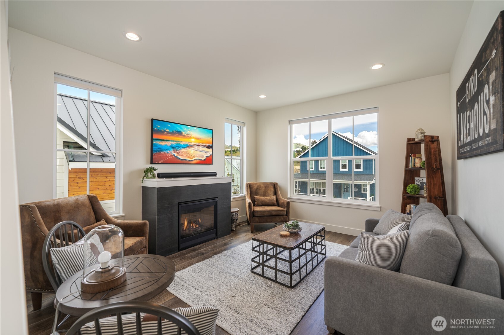 187 Bobcat Lane Chelan, WA 98816 - Photo 13 of 40 a living room with furniture a fireplace and a large window