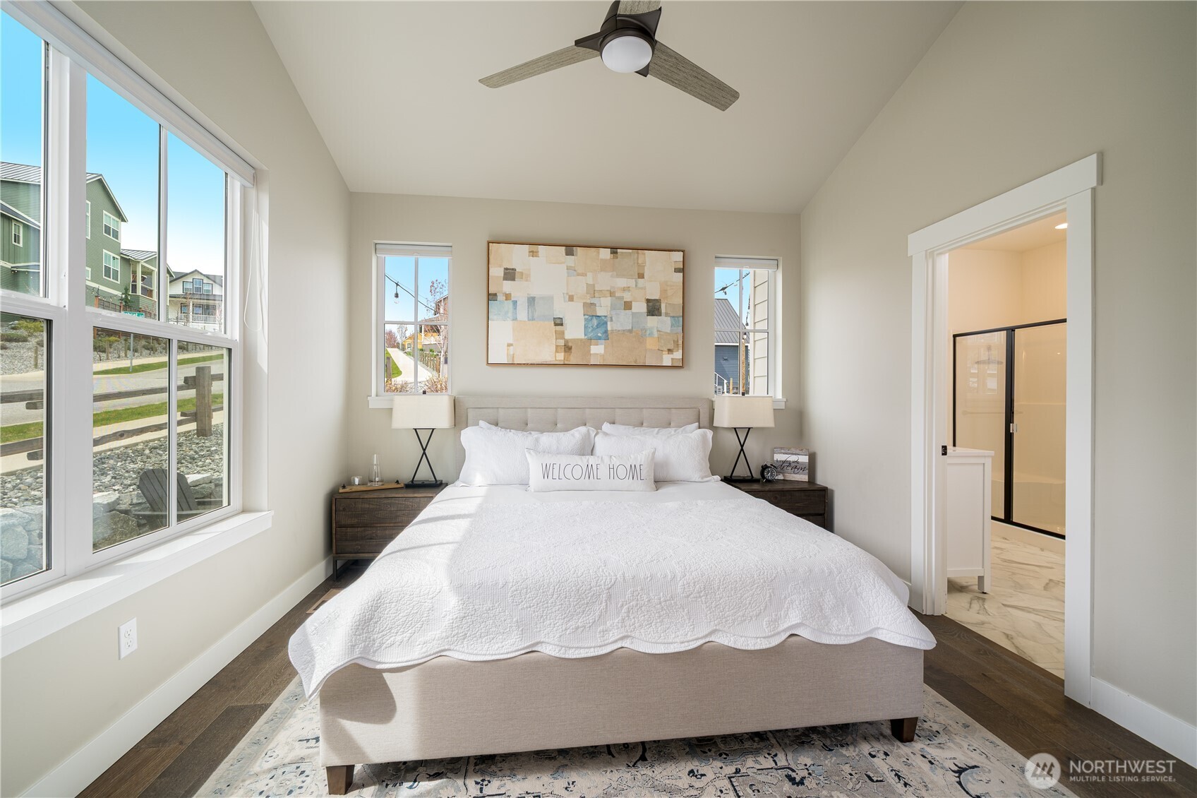 187 Bobcat Lane Chelan, WA 98816 - Photo 15 of 40 a large white bed in a white room