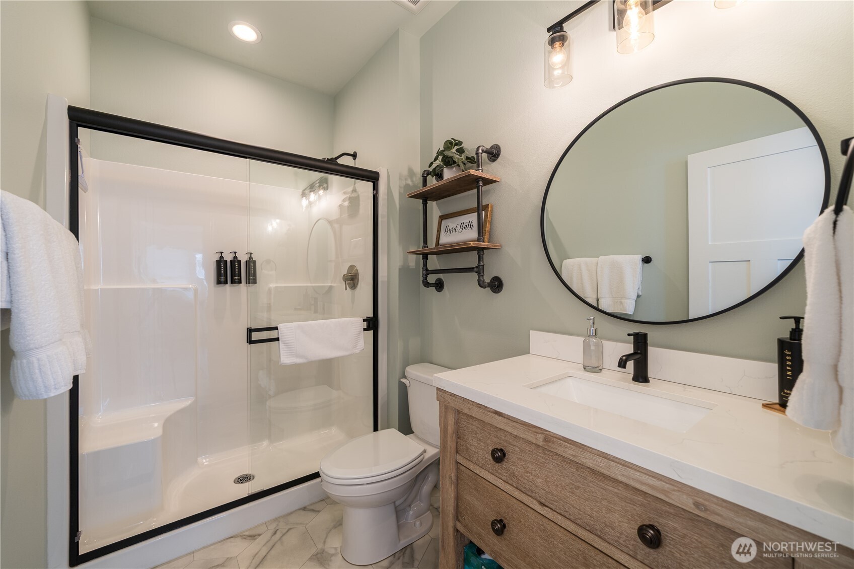 187 Bobcat Lane Chelan, WA 98816 - Photo 17 of 40 a bathroom with a sink a mirror a toilet and a mirror