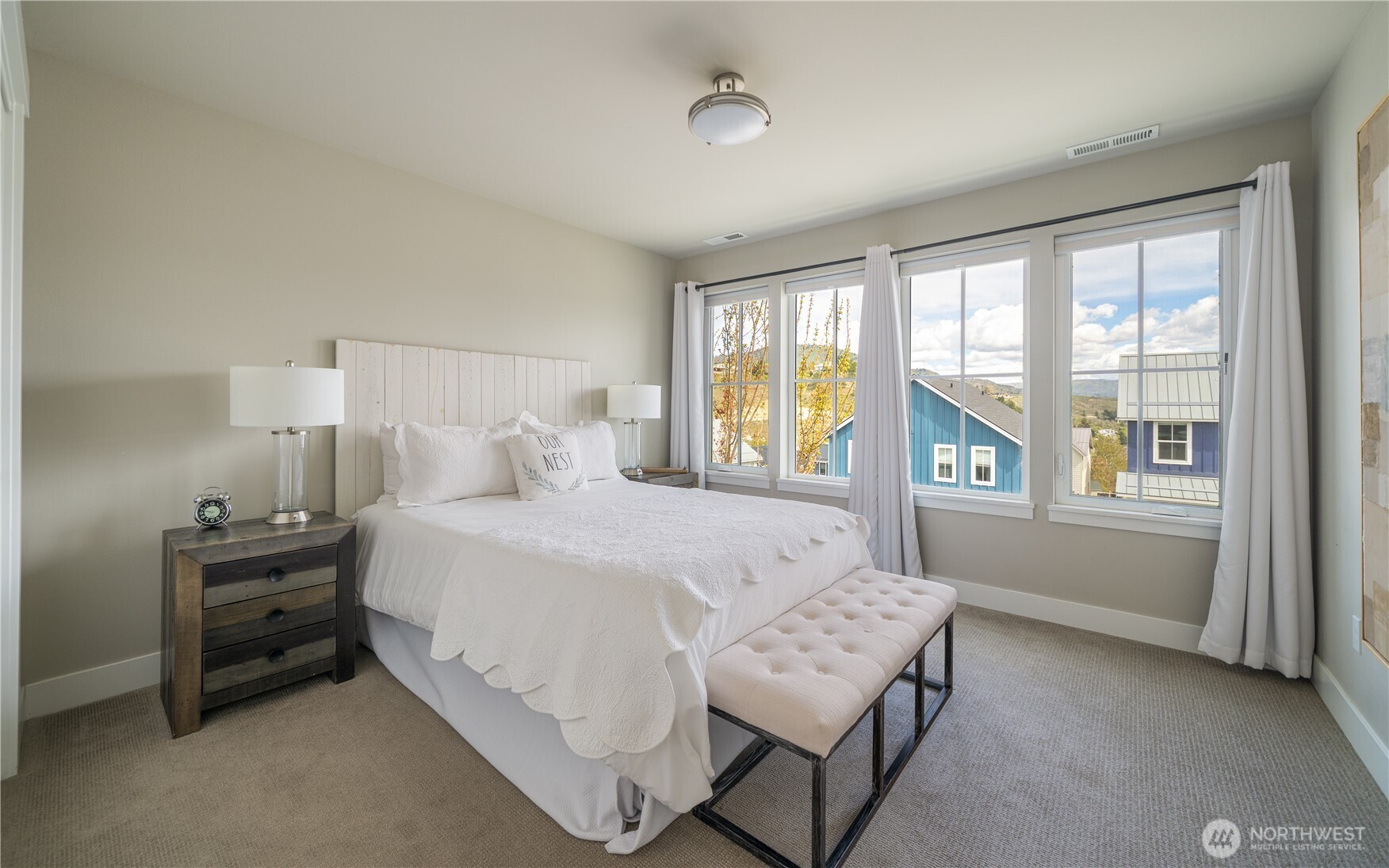 187 Bobcat Lane Chelan, WA 98816 - Photo 19 of 40 a bedroom with a bed and a window