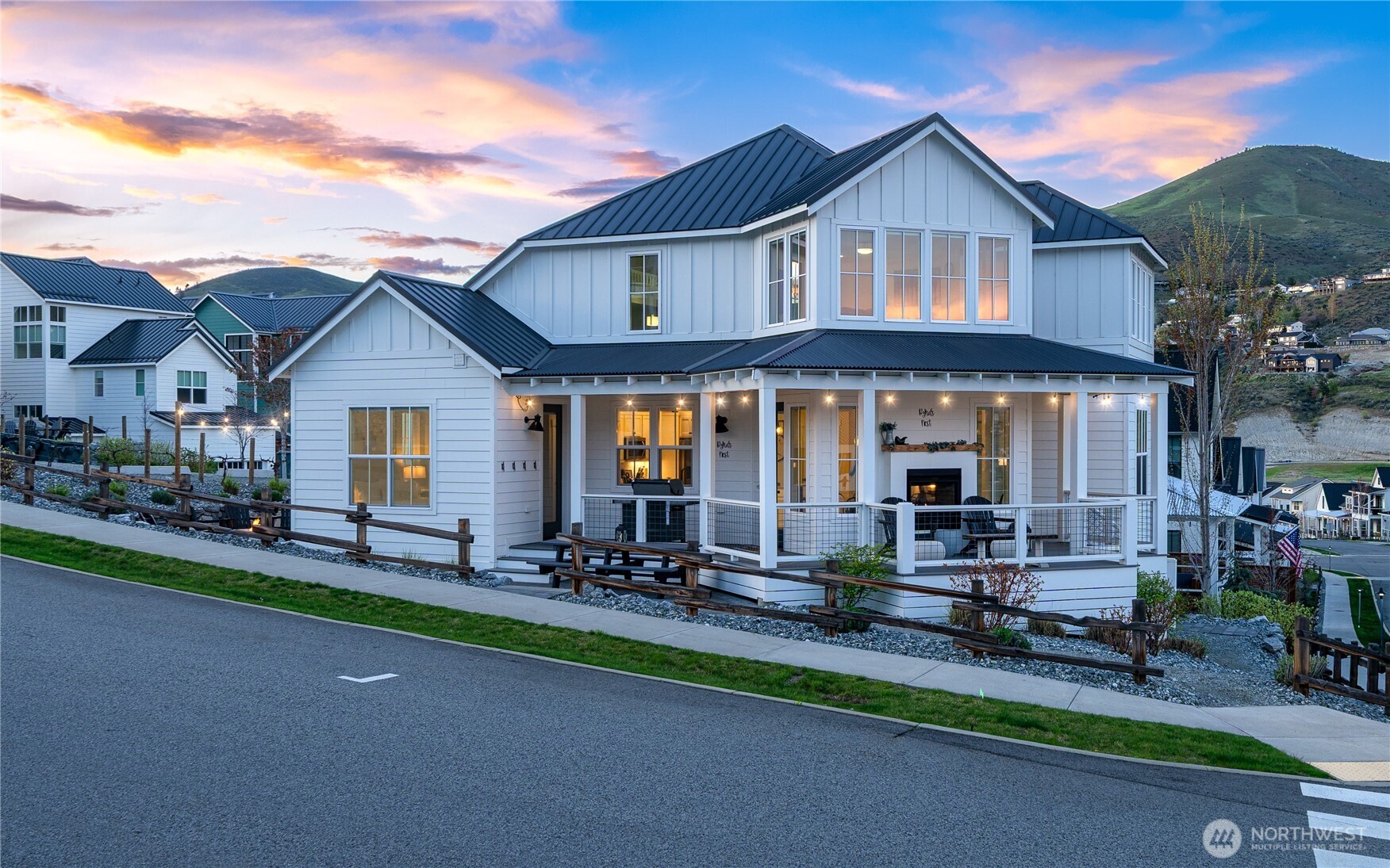 187 Bobcat Lane Chelan, WA 98816 - Photo 2 of 40 a front view of a house with a garden and patio