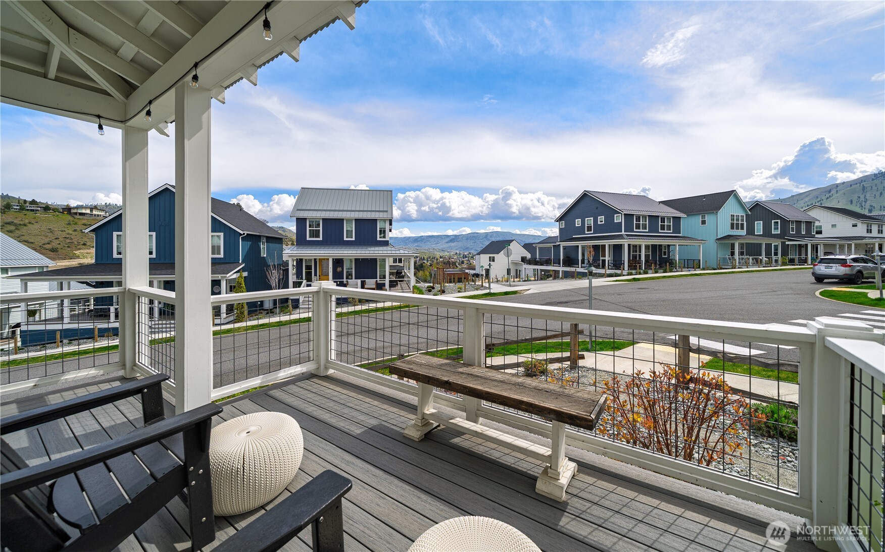 187 Bobcat Lane Chelan, WA 98816 - Photo 28 of 40 a view of a balcony with two chairs and a potted plant
