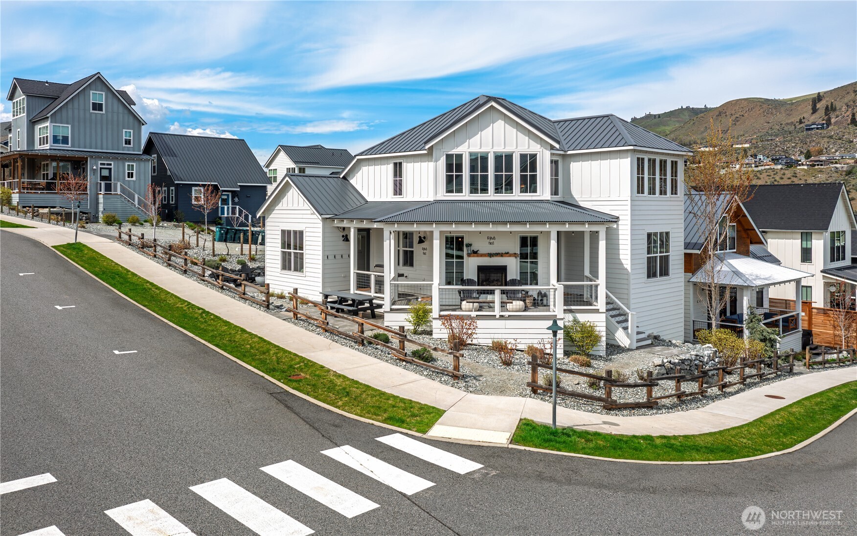 187 Bobcat Lane Chelan, WA 98816 - Photo 4 of 40 a front view of a house with swimming pool