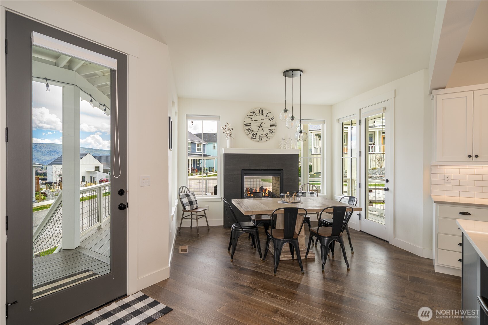 187 Bobcat Lane Chelan, WA 98816 - Photo 9 of 40 a view of a a dining room with furniture window and wooden floor