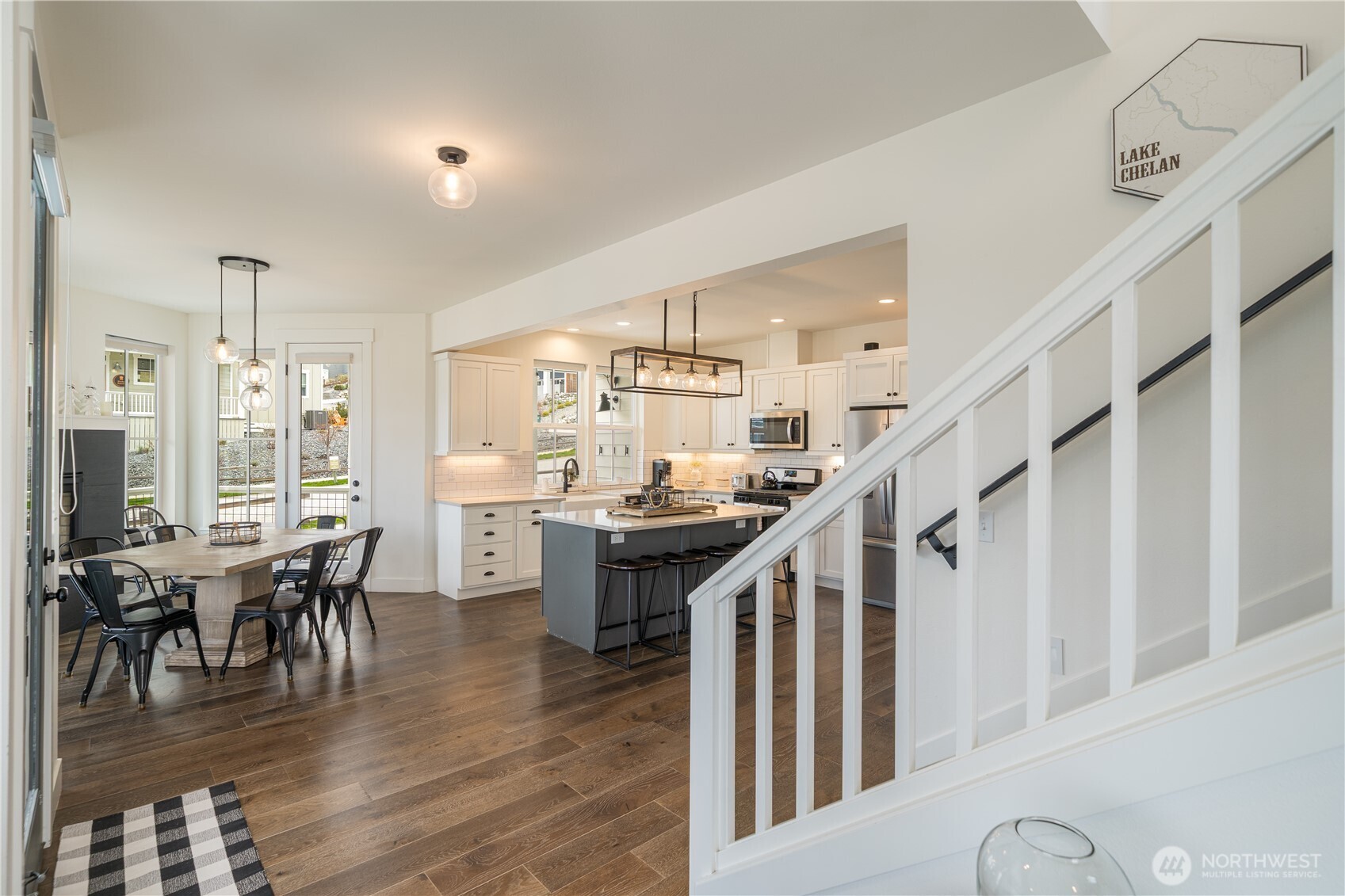 187 Bobcat Lane Chelan, WA 98816 - Photo 10 of 40 a dining room with furniture entryway and wooden floor