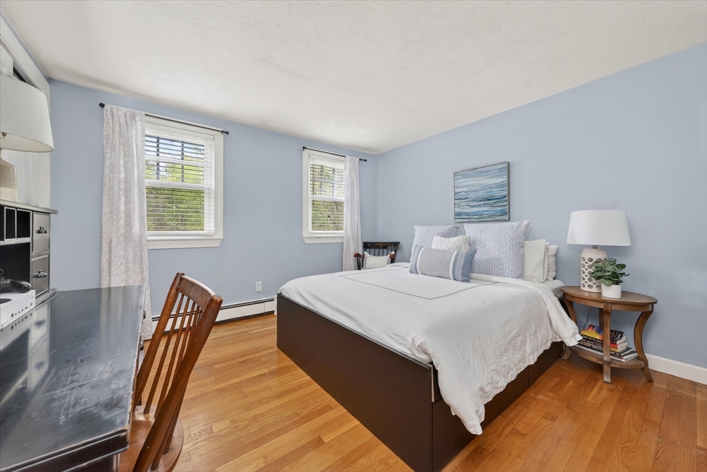 59 First Parish Road Norwell, MA 02061 - Photo 23 of 37 a bed room with a bed and a chair