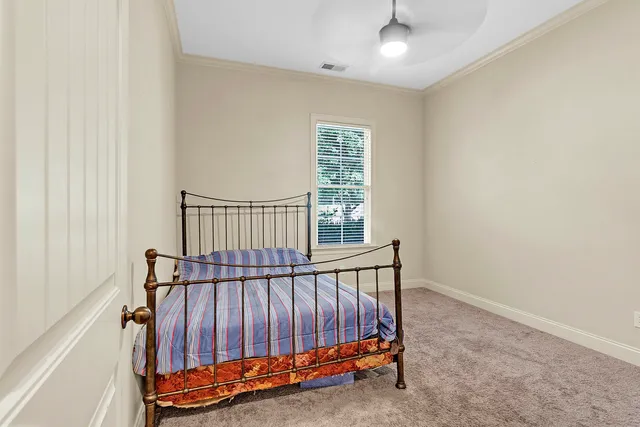 a view of staircase with railing and a rug
