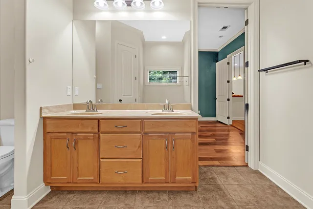 a bathroom with a sink double vanity and a mirror